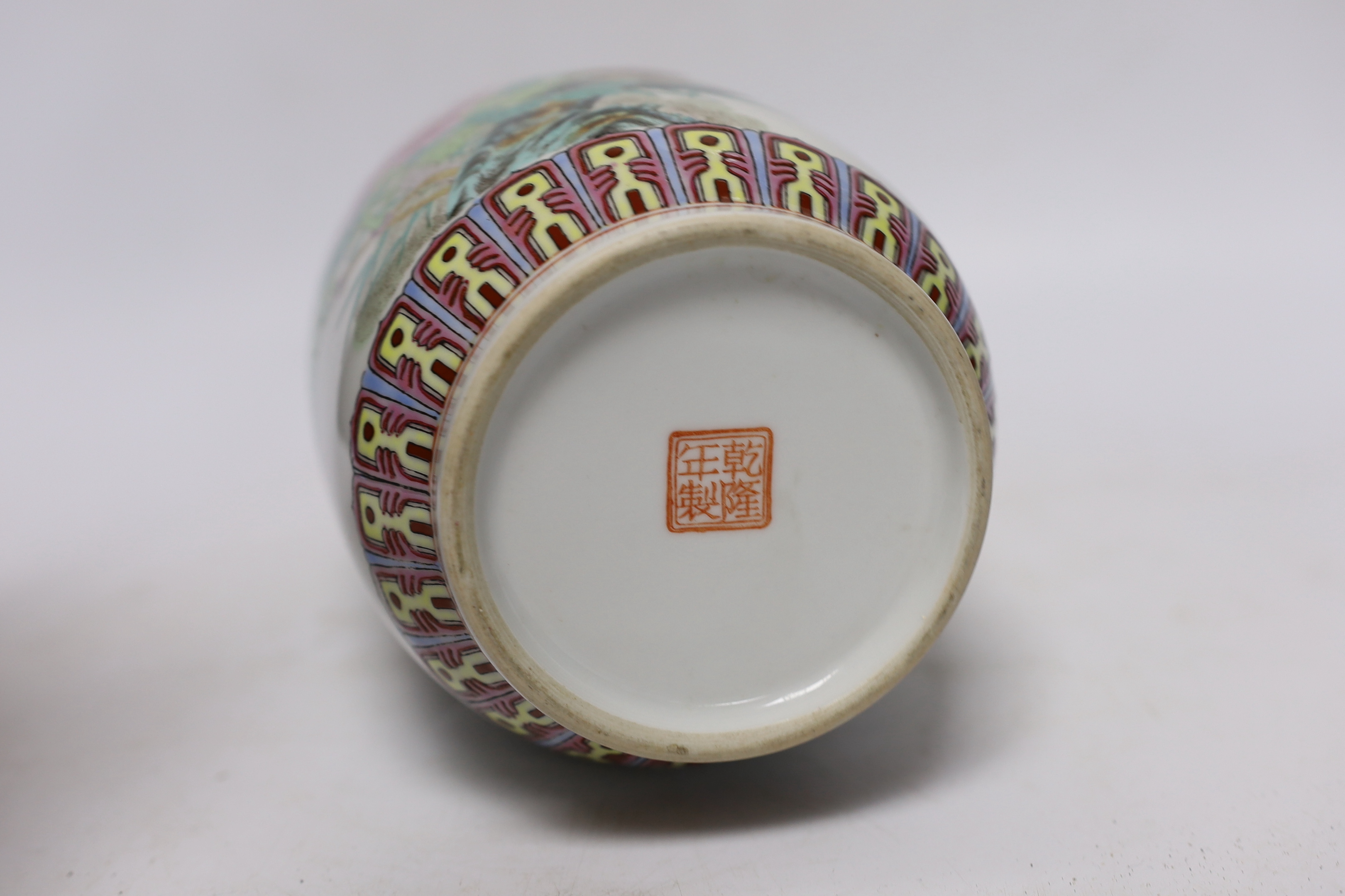 A Chinese famille rose vase, two Japanese blue and white rice bowls and covers and a Japanese blue and white vase (4) tallest 24.5cm